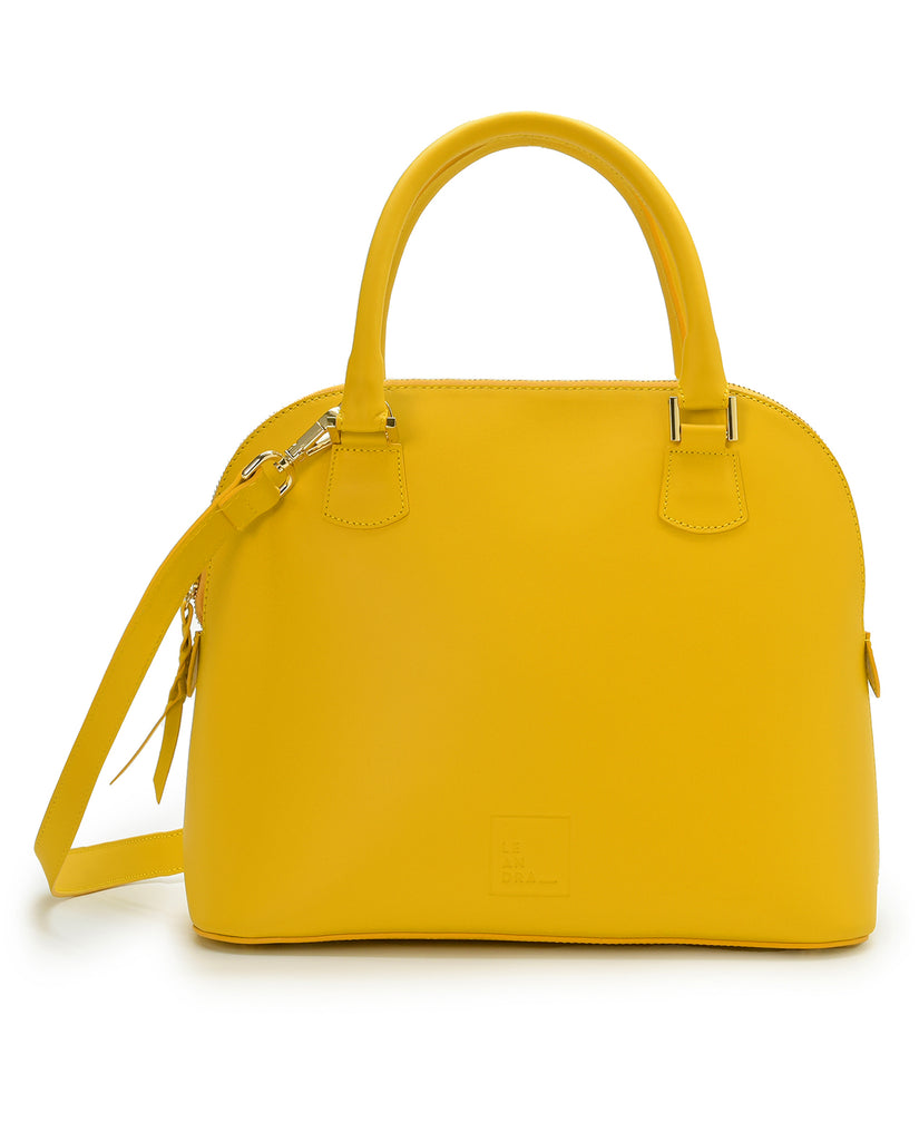 Imagen frontal de bolso de mano tipo bugatti color amarillo Leandra. Made in Spain