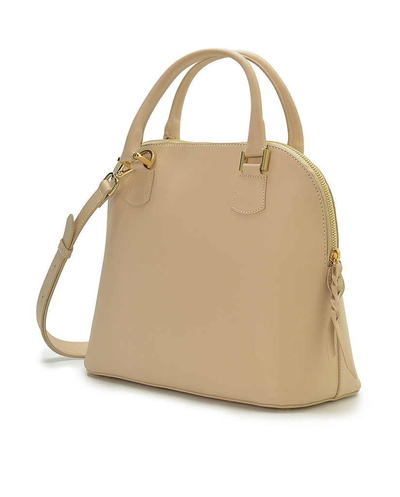 Imagen lateral de bolso de mano de piel color beige Leandra. Made in Spain