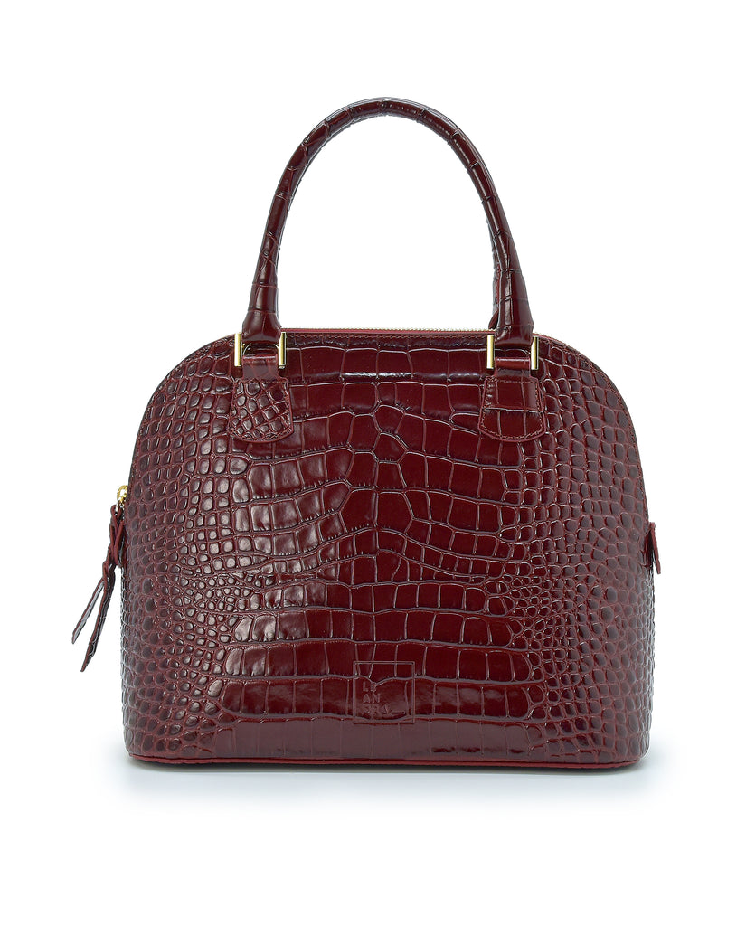 Imagen frontal asa mano de bolso de mano de piel grabada en coco color burdeos Leandra.
