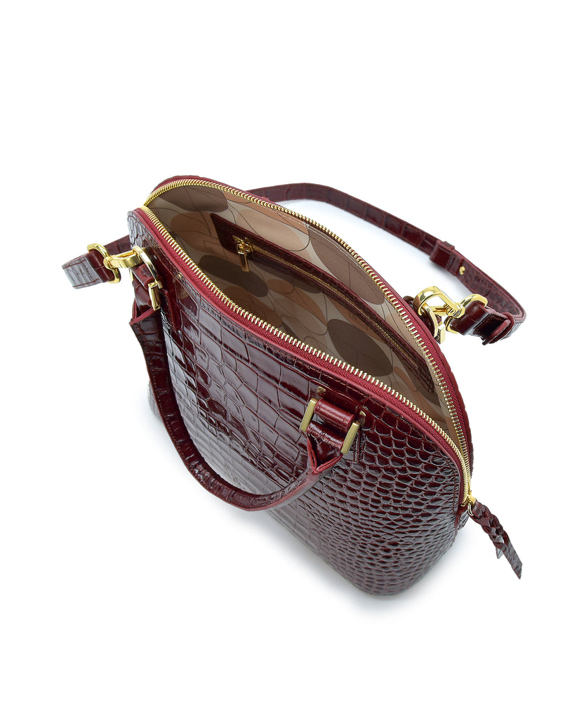 Imagen interior de bolso de mano de piel grabada en coco color burdeos Leandra.
