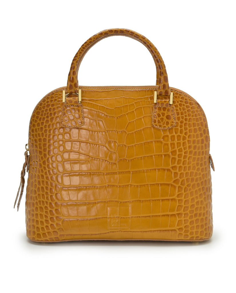 Imagen frontal con asa de mano del bolso de mano de piel grabada en coco color camel Leandra. Bolsos de piel fabricados en Ubrique Made in Spain