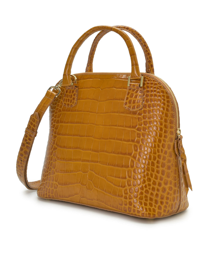Imagen lateral de bolso de mano de mujer de piel grabada en coco color camel Leandra. Made in Spain