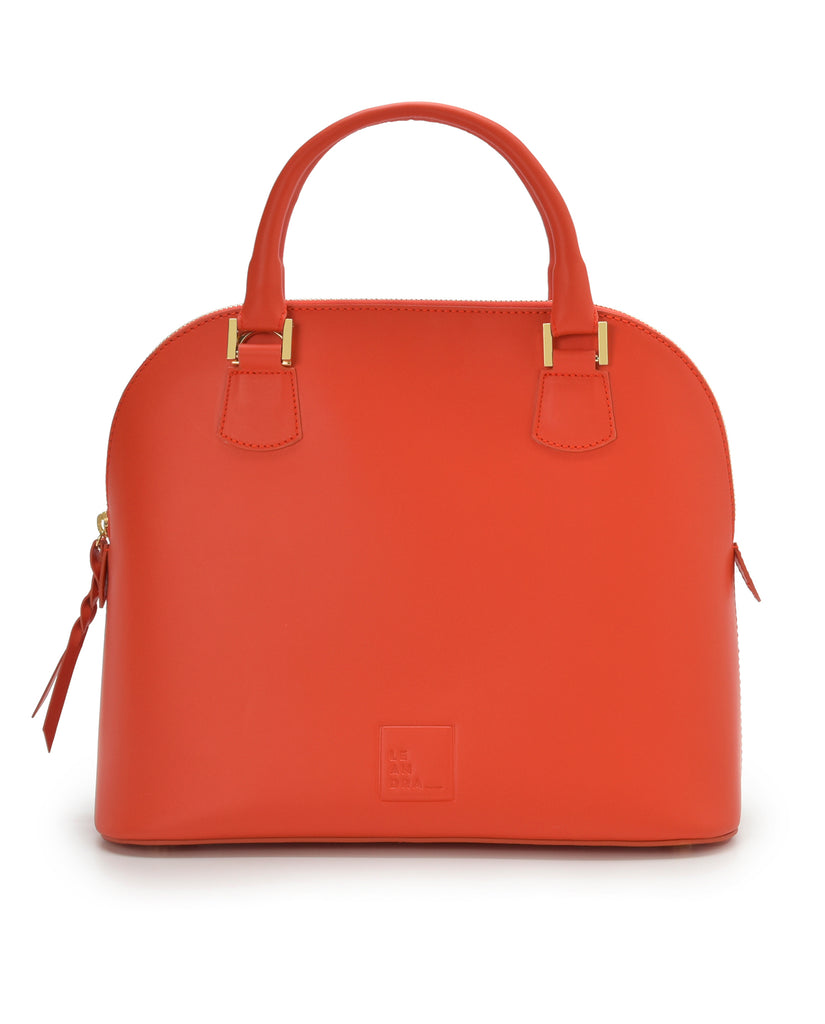 Imagen asa de mano de bolso de mano de piel color naranja Leandra a la venta en leandrabrand.com. Fabricado en Ubrique, España