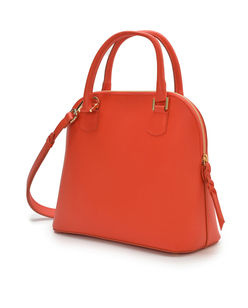 Imagen lateral de bolso de mano de piel color naranja Leandra. Fabricado en Ubrique, España