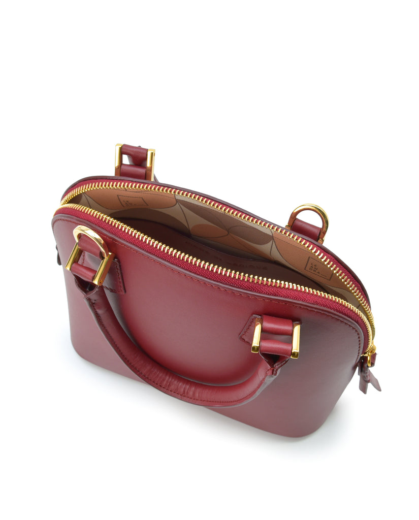 Interior asa corta de bolso de mano mini de piel color burdeos Leandra. Bolso made in Spain