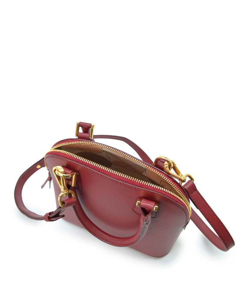 Interior asa corta de bolso de mano mini de piel color burdeos Leandra. Bolsos made in Spain