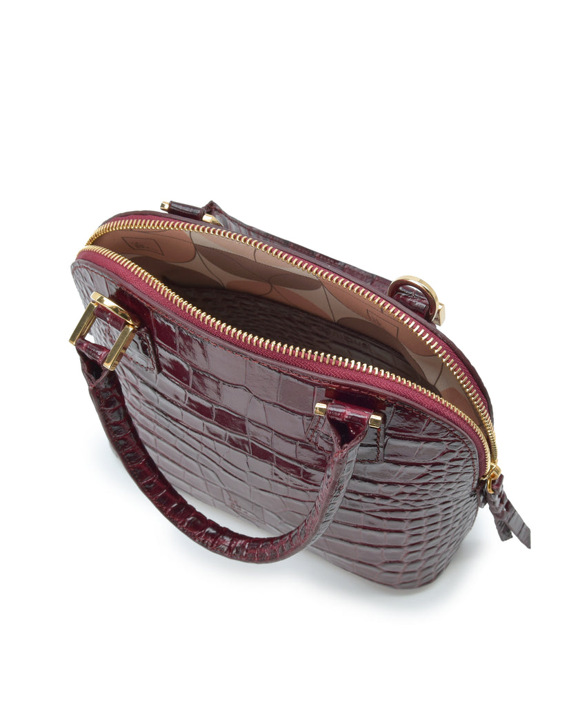 Interior asa corta de bolso de mano mini de piel grabada en coco color burdeos Leandra. Made in Spain