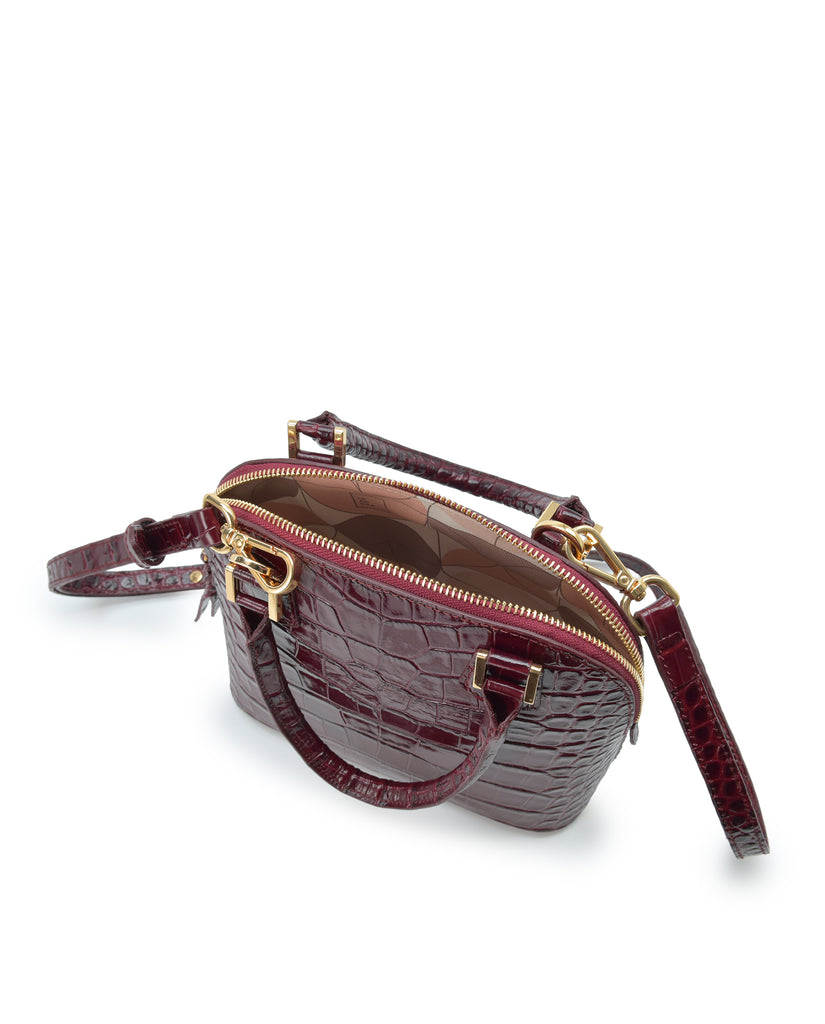 Interior bolso de mano mini de piel grabada en coco color burdeos Leandra. Made in Spain