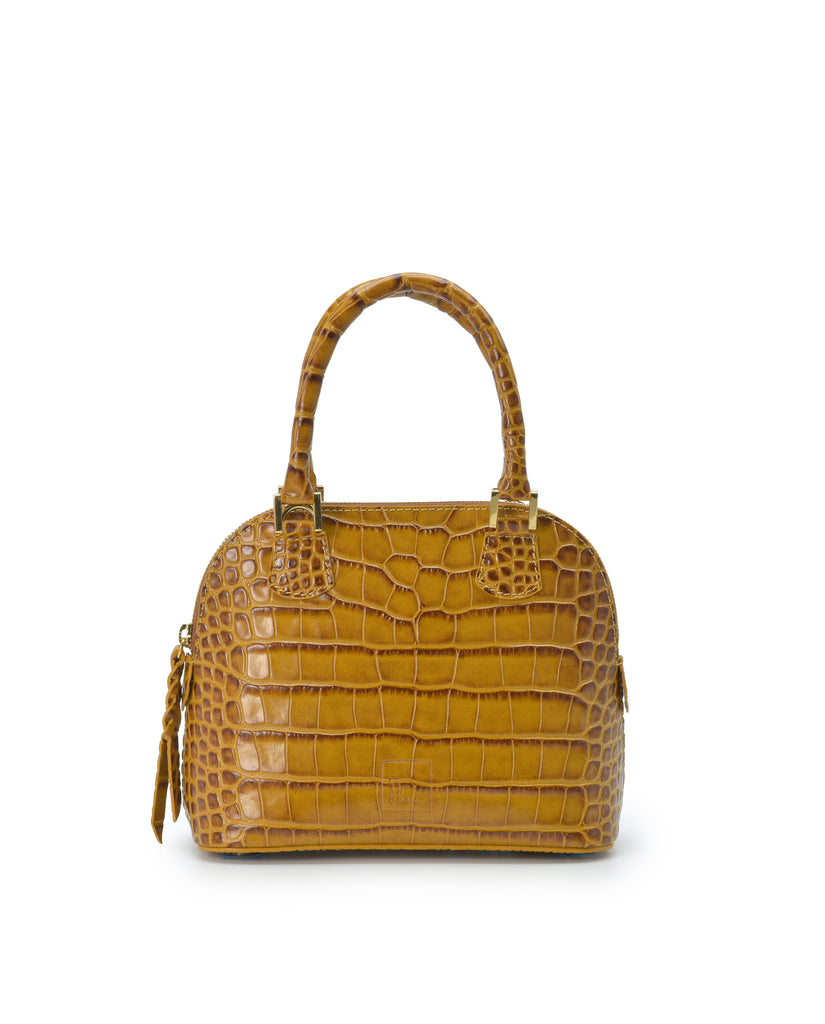 Imagen frontal con asa de mano del bolso de mano mini de piel grabada en coco color camel Leandra. Bolsos de piel fabricados en Ubrique Made in Spain