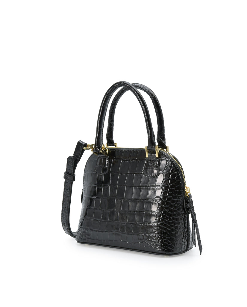 Imagen lateral de bolso de mano mini de piel grabada en coco color negro Leandra. Made in Spain