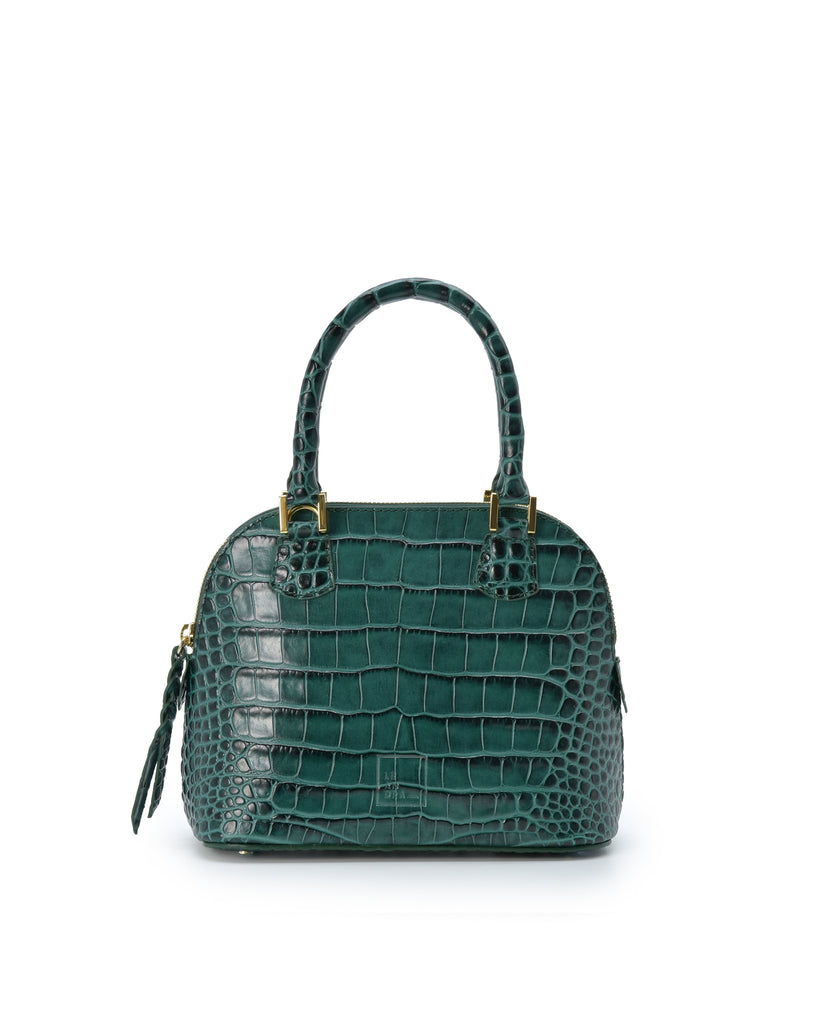 Imagen frontal con asa de mano del bolso de mano mini de piel grabada en coco color verde Leandra. Bolsos de piel fabricados en Ubrique Made in Spain