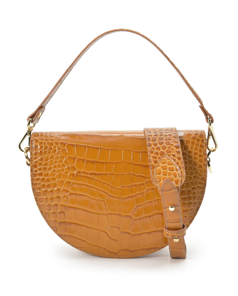 Imagen trasera de bolso de piel de mujer tipo bandolera Saddle bag de piel grabada en coco color camel Leandra. Bolso bandolera de piel fabricado en Ubrique, España Leandra a la venta en leandrabrand.com