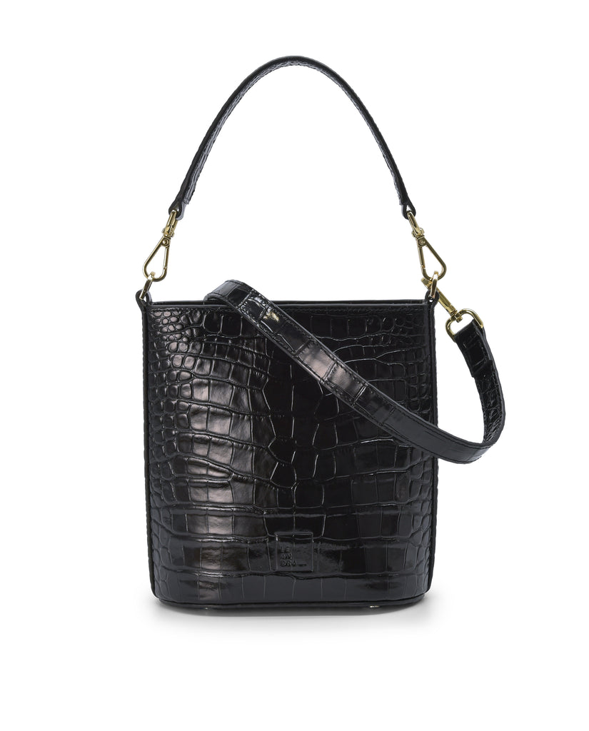 Imagen frontal de bolso bucket multiposición de piel grabada en coco color negro con cremallera Leandra. Bolso made in Spain