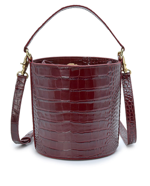 Imagen trasera de bolso bucket de piel grabada en coco burdeos fabricado en España Leandra