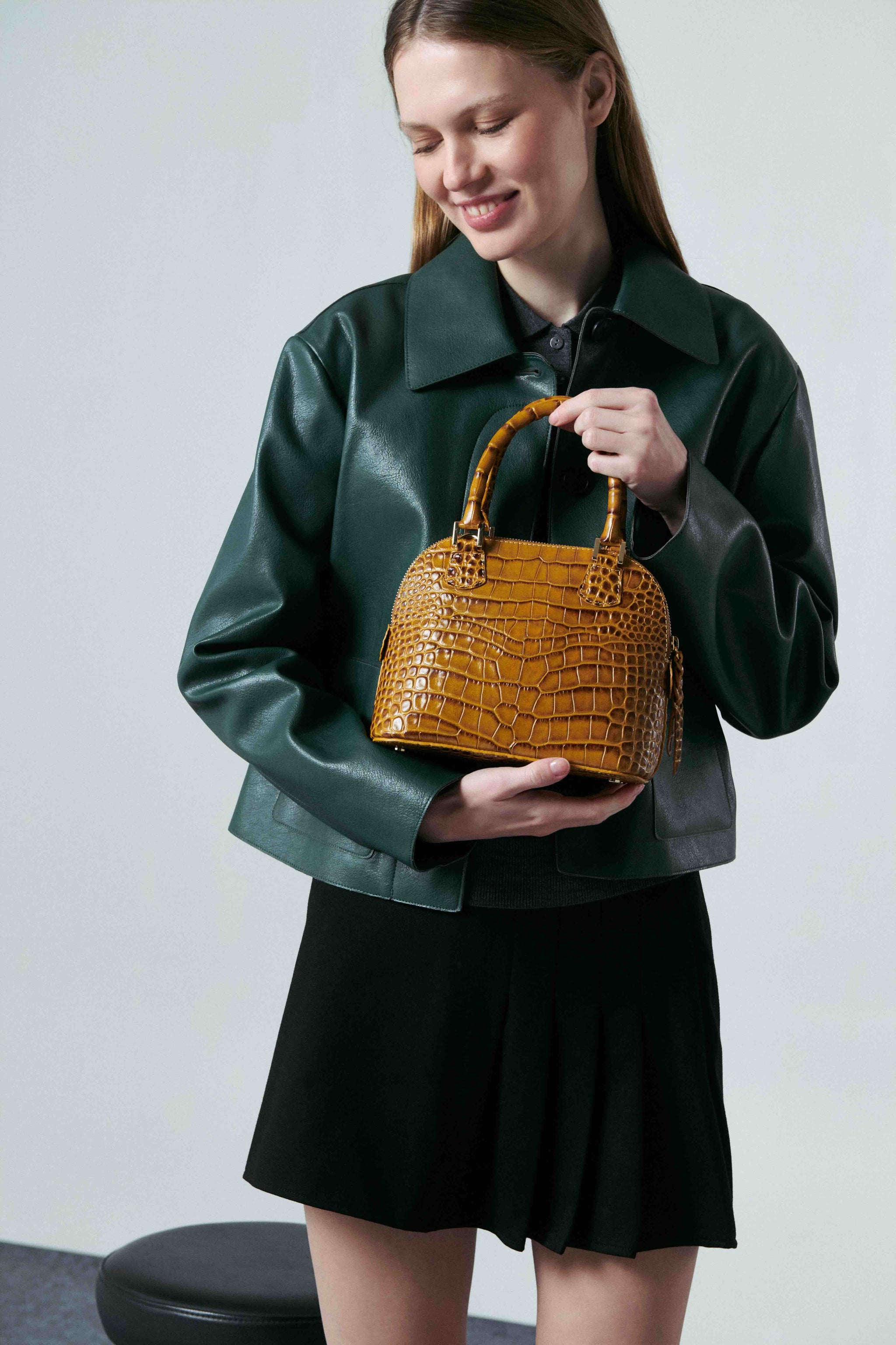 Leandra mini handbag in camel-colored embossed crocodile leather