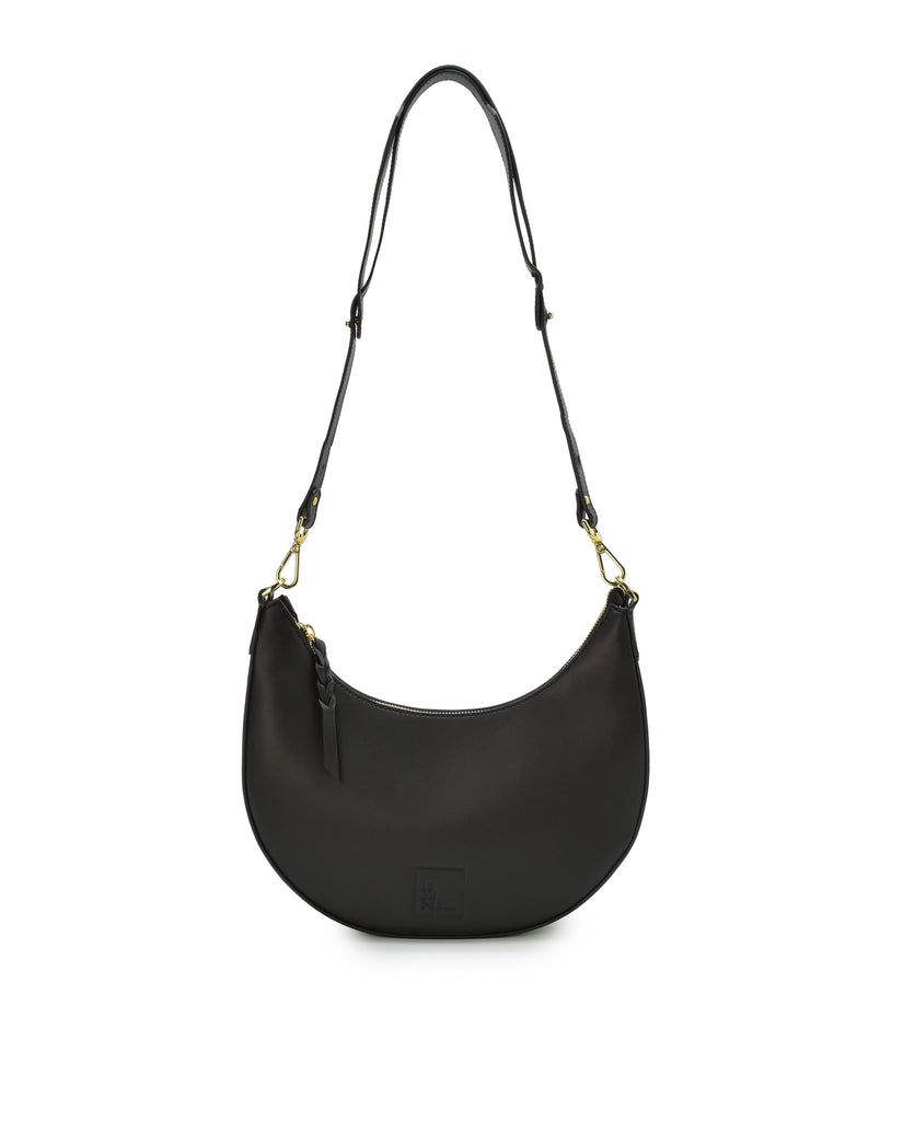 Imagen asa larga de bolso media luna de piel color negro Leandra. Made in Spain 