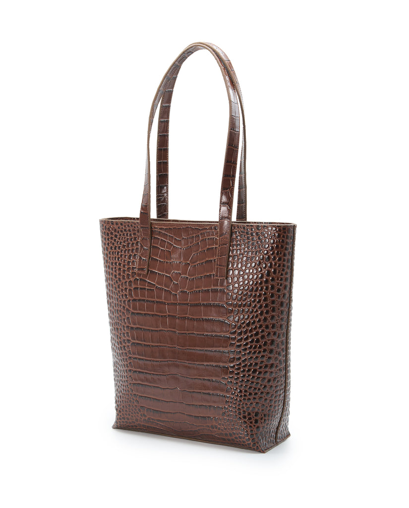 Imagen lateral de bolso shopper multiposición de piel grabada color marrón con cremallera Leandra. Bolso made in Spain