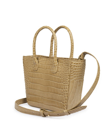 Imagen lateral de bolso tipo trapecio de piel grabado en coco arena. Bolso de piel tipo trapecio grabado en coco Leandra fabricado en Ubrique, España a la venta en leandrabrand.com