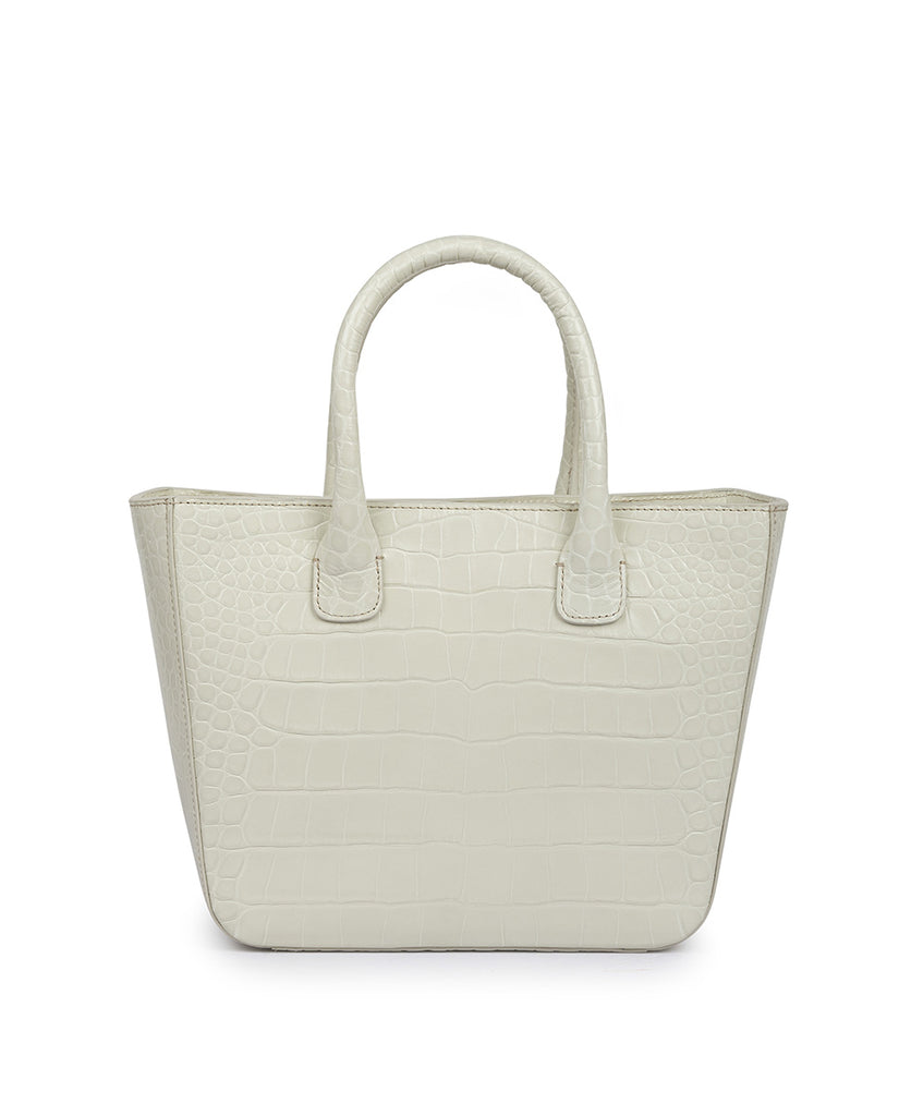 Imagen frontal asas de mano de bolso tipo trapecio de piel grabada en coco blanco roto Leandra. Bolso piel blanco made in Spain Leandra