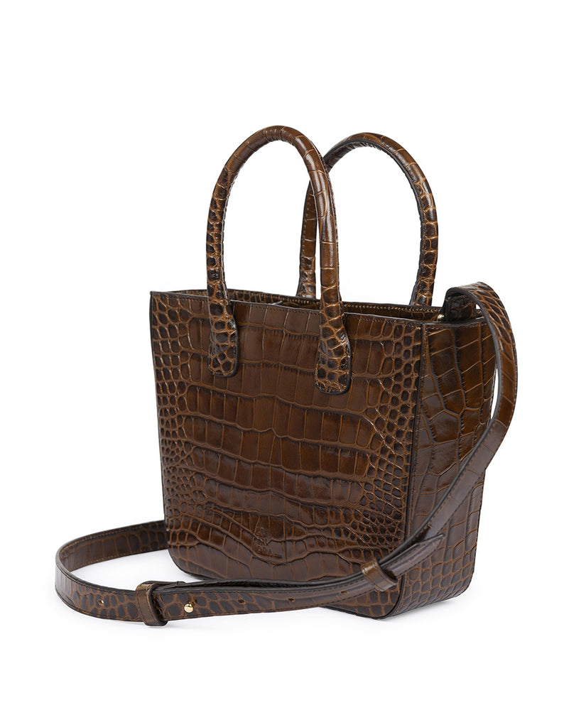 Imagen de bolso lateral tipo trapecio de piel grabada en coco marrón Leandra. Bolso made in Spain Leandra a la venta en leandrabrand.com