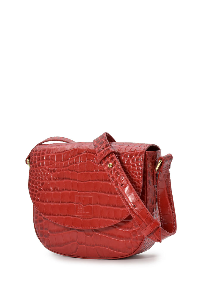 Bandolera de piel con solapa de piel grabada en coco rojo Leandra a la venta en leandrabrand.com