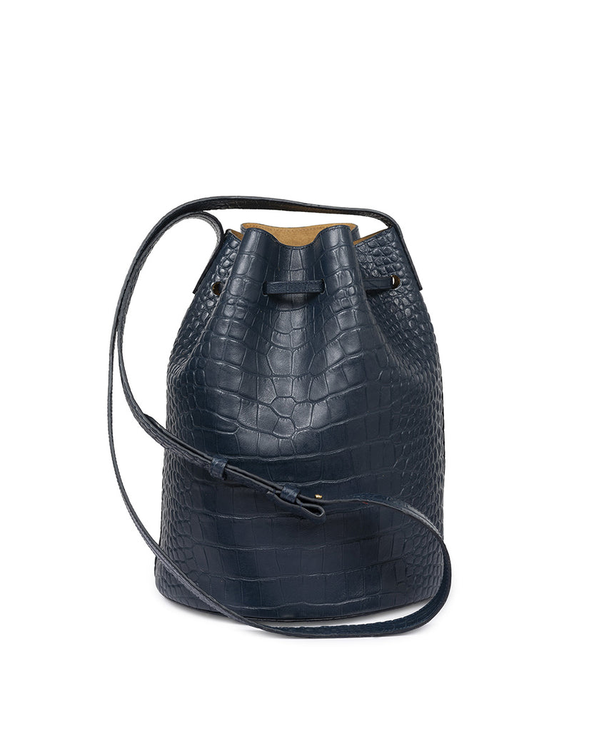 Bolso bucket bag de piel vacuno grabado en coco azul Leandra. Bolsos Leandra Made in Spain a la venta en leandrabrand.com imagen trasera