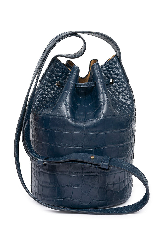 Bolso tipo mini bucket grabado en coco suave color azul oscuro Leandra. Bolso piel vacuno grabada en coco azul Leandra imagen trasera.